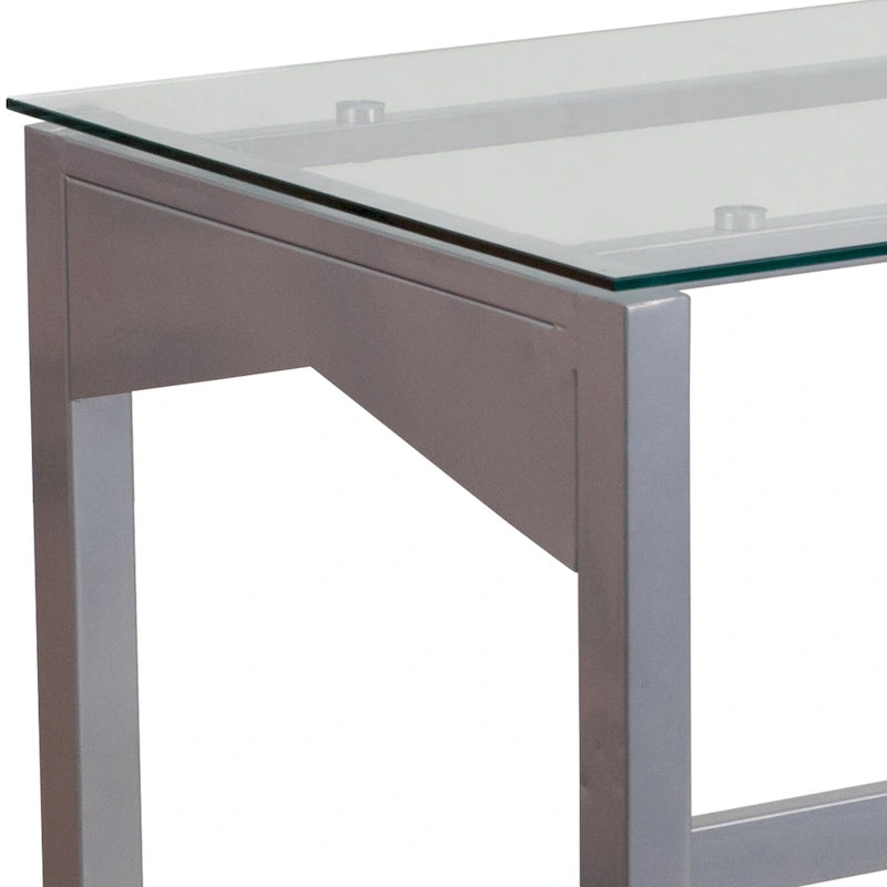 Bureau contemporain en verre trempé transparent avec pieds géométriques et cadre argenté